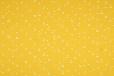 Generate print - yellow background with small white triangles over it